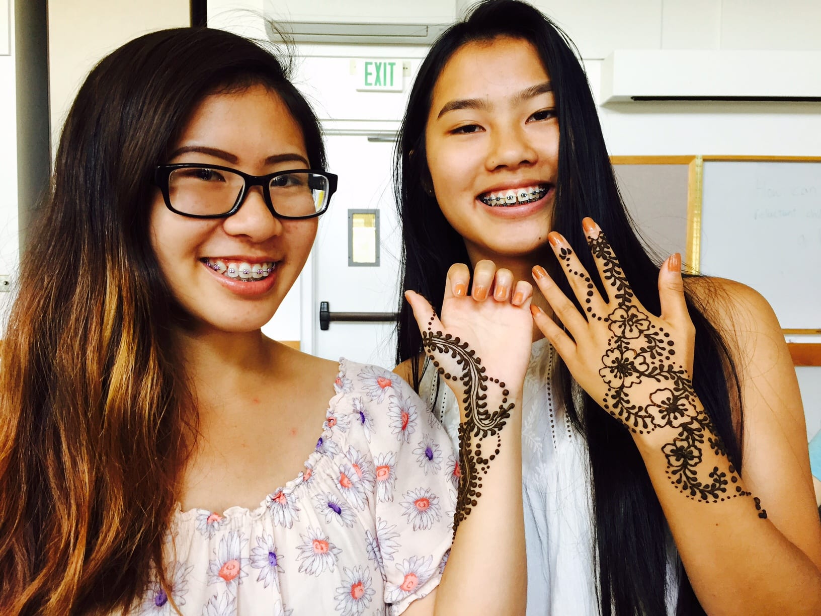 Two Teens with Henna on Hands