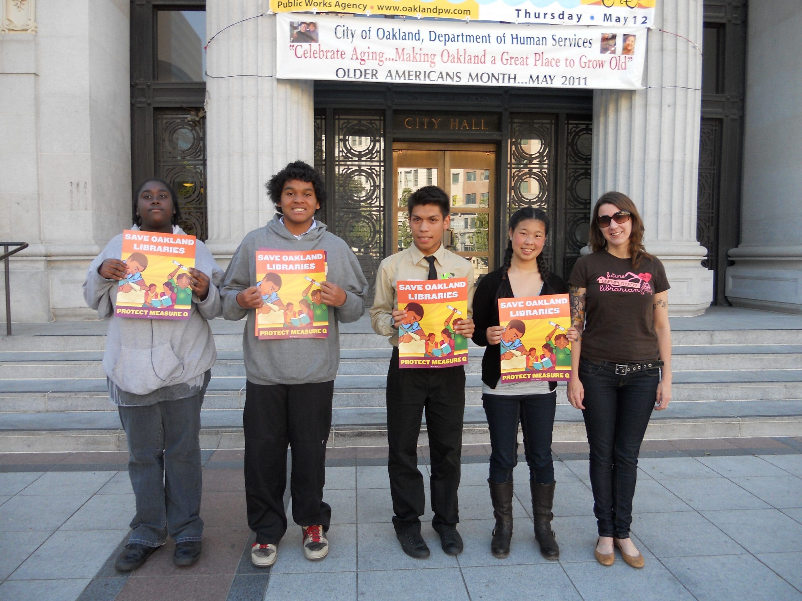 YLC with Save Oakland Libraries signs