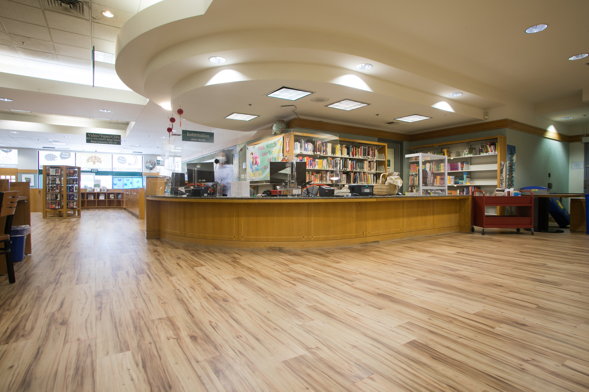 The Asian Branch of the Oaklabd Public Library with newly placed flooring through the branch.