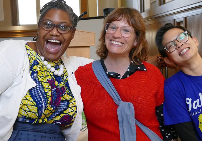 Three OPL team members smile at the camera during a FOPL event at the African American Museum and Library at Oakland
tags:
OPL staff, AAMLO, smiling